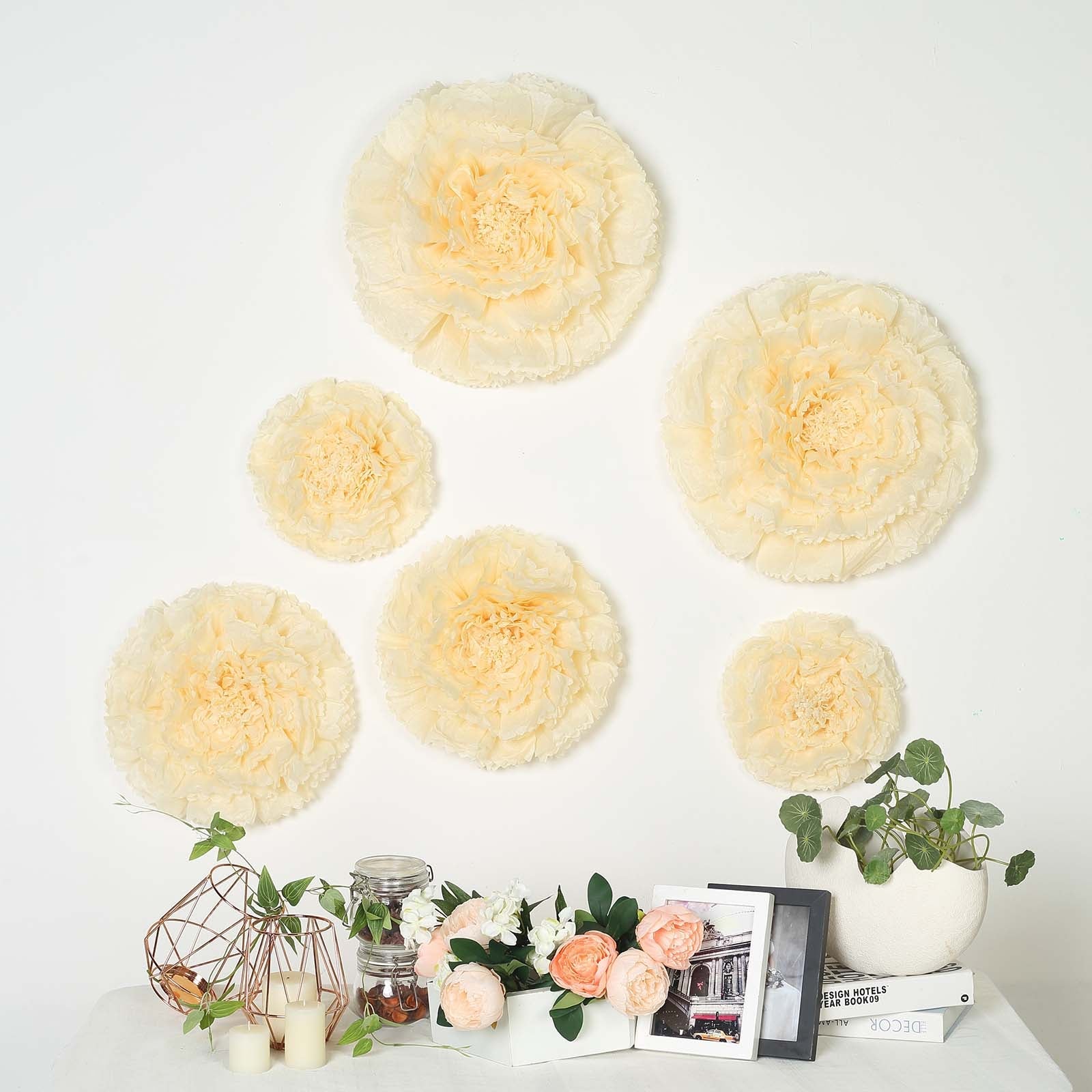 Carnation ivory 3D wall tissue paper flowers in multiple sizes.