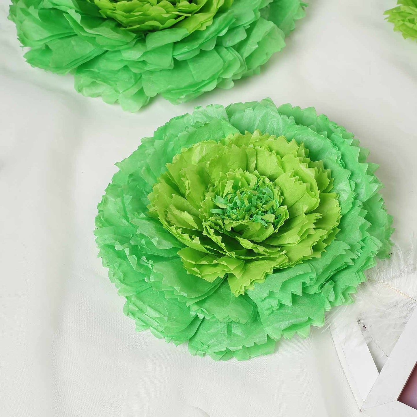Mint green 3D giant paper flower, perfect for backdrops and decorations.