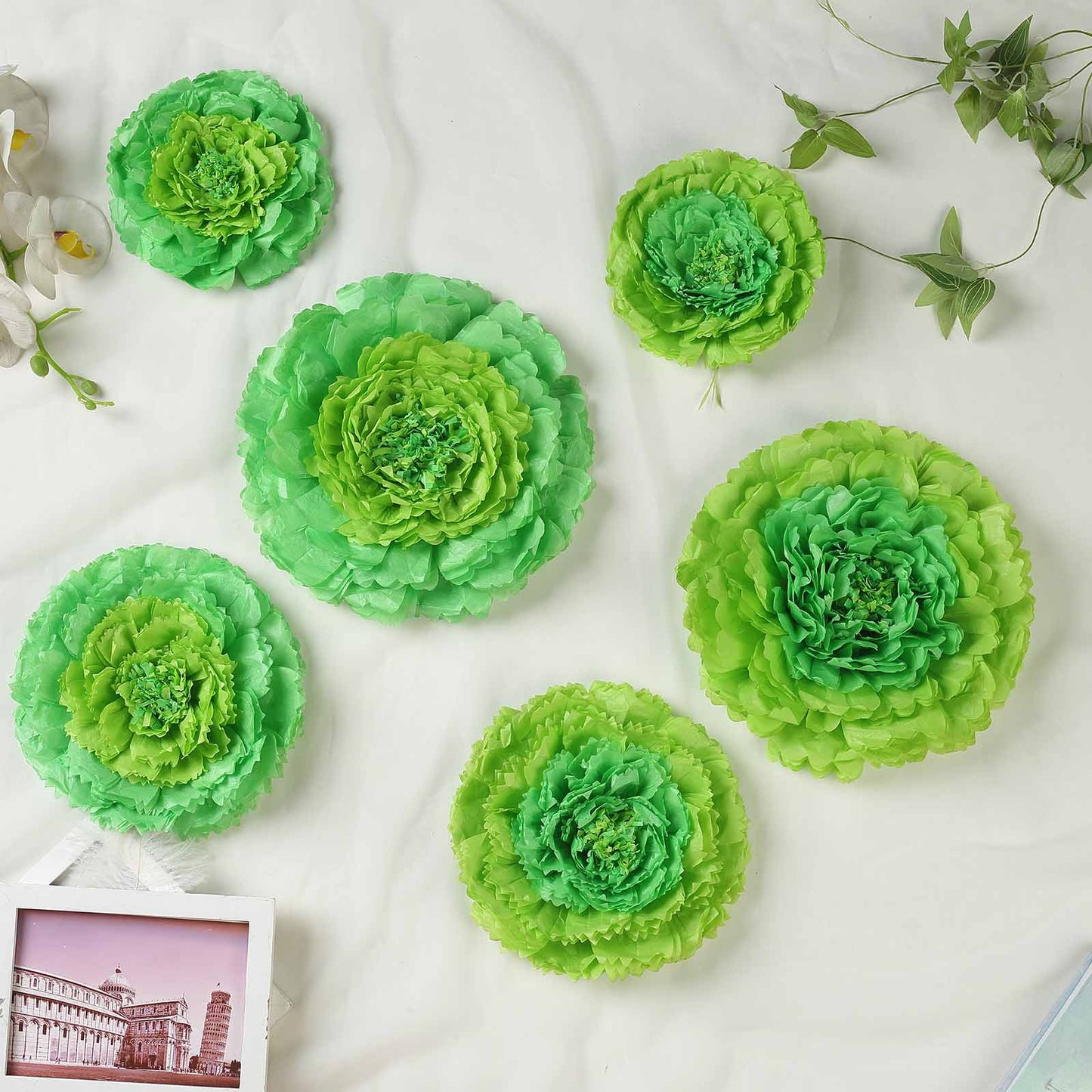 Mint green 3D giant paper flowers in multiple sizes for wedding backdrops.
