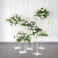 Clear acrylic wedding centerpiece vase with square mirror base and floral arrangement.