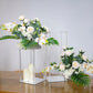 Clear acrylic wedding centerpiece vase with square mirror base, floral arrangement.