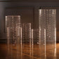 Clear acrylic cylinder pedestal stands for wedding display.