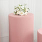 Dusty rose spandex pedestal stand cover with floral arrangement.
