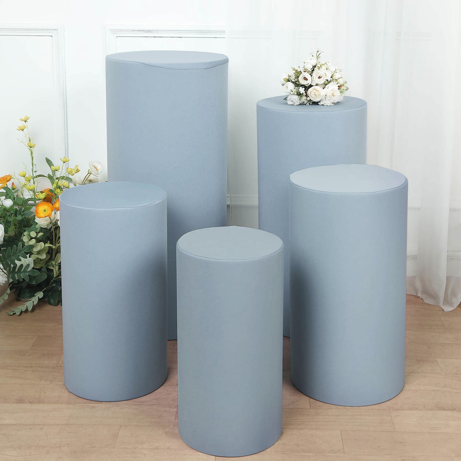 Dusty blue spandex pedestal stand covers, set of 5, for event display.