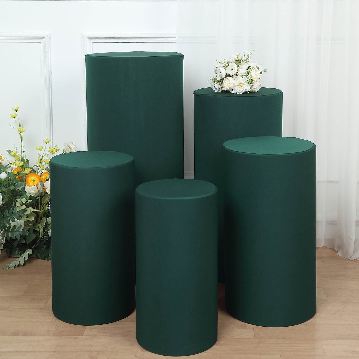 Emerald green spandex pedestal stand covers set of 5 for events and décor.