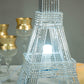Color changing LED metal Eiffel Tower in silver with warm light.