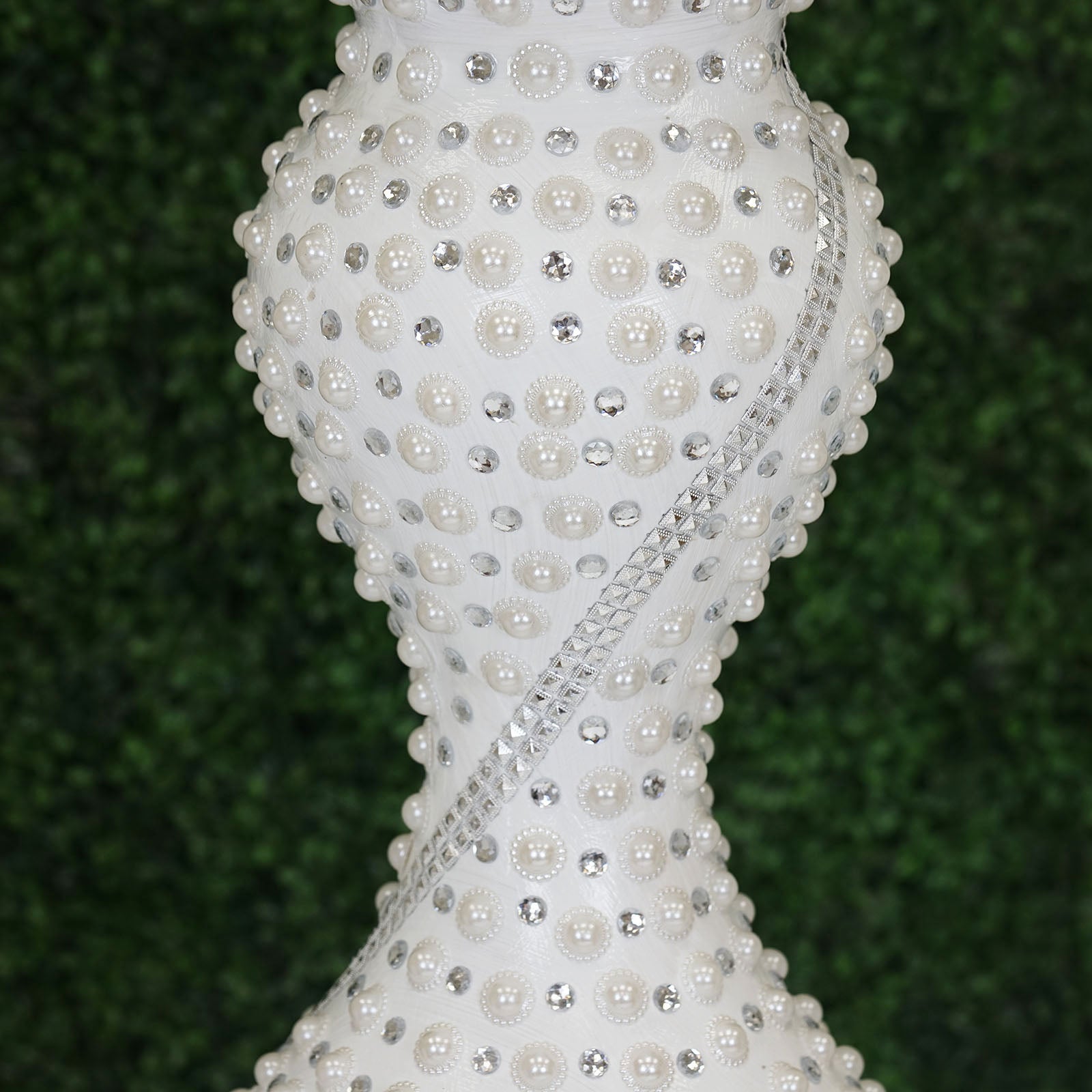 White pearl-studded floor vase with a mosaic design.