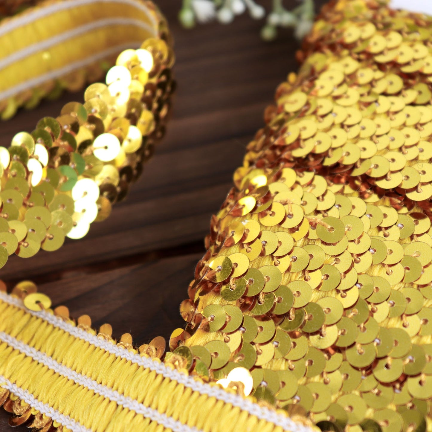 Metallic gold sequin stretch fabric ribbon for crafts.