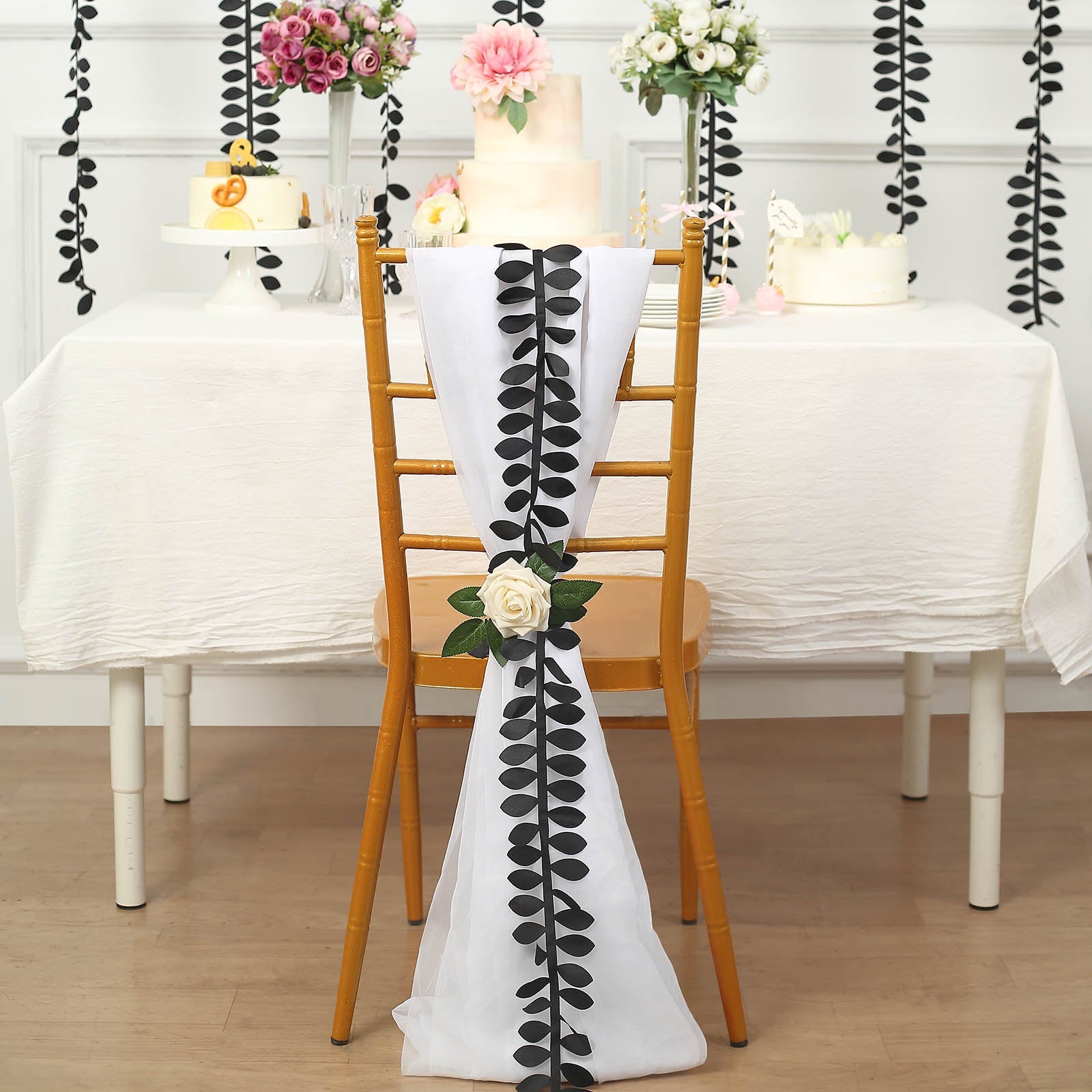 Black leaf taffeta ribbon sash on a chair for decoration.