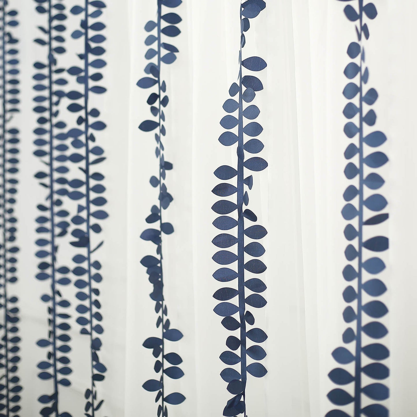 Navy blue leaf petal taffeta ribbon sash garlands on a white background.