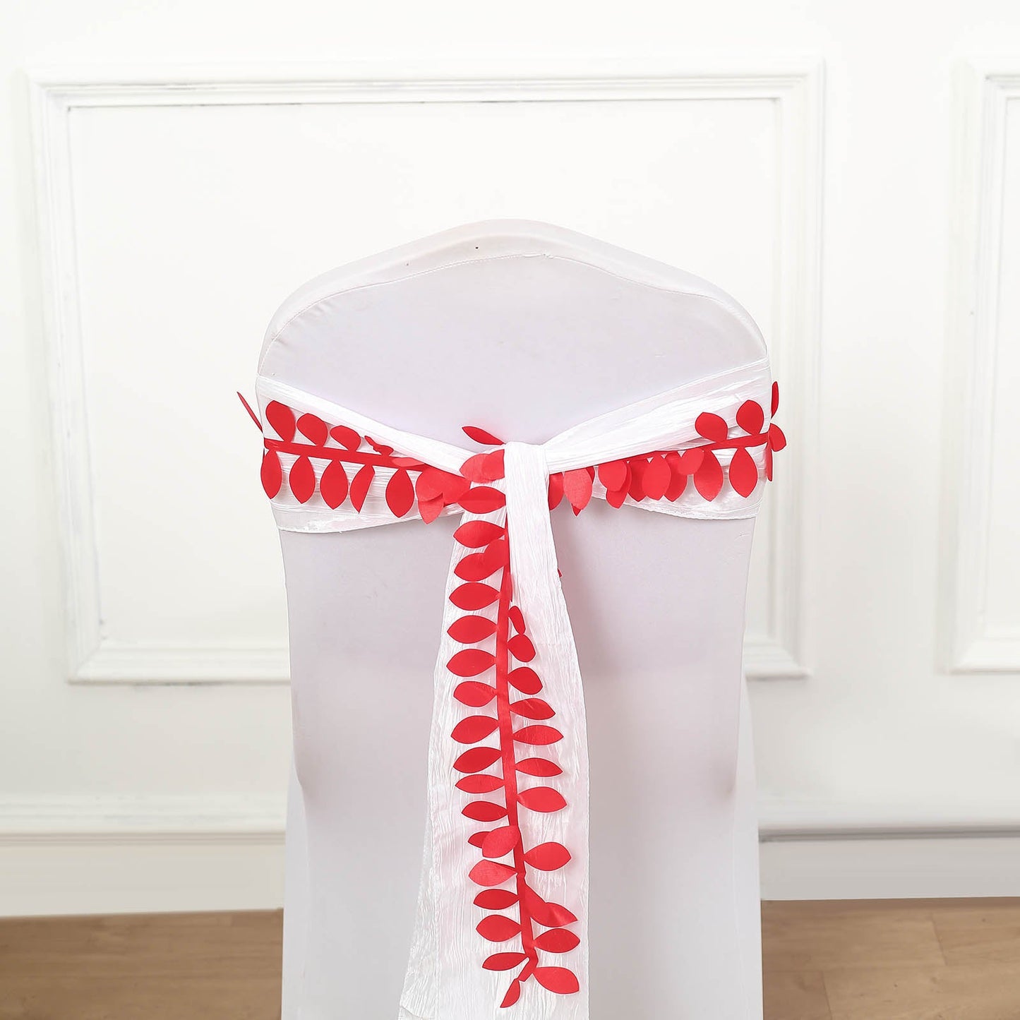 Red leaf petal taffeta ribbon sash on a chair, perfect for DIY garlands.