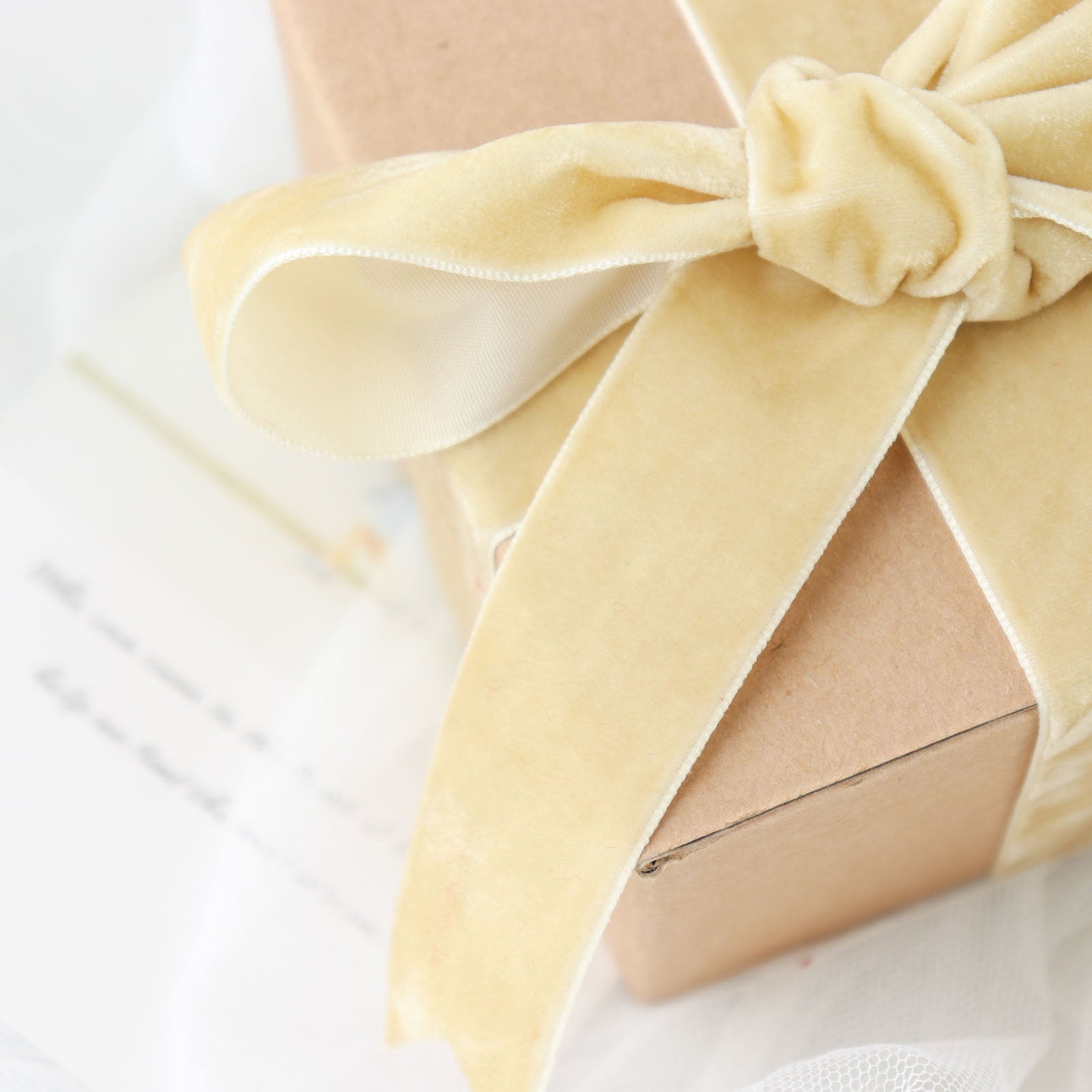 Champagne velvet ribbon spool for DIY crafts.