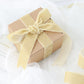 Champagne velvet ribbon spool for DIY crafts, 10 yards long.