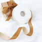 gold velvet ribbon spool on a white background with a gift box