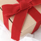Red velvet ribbon spool for DIY crafts, 10 yards long.