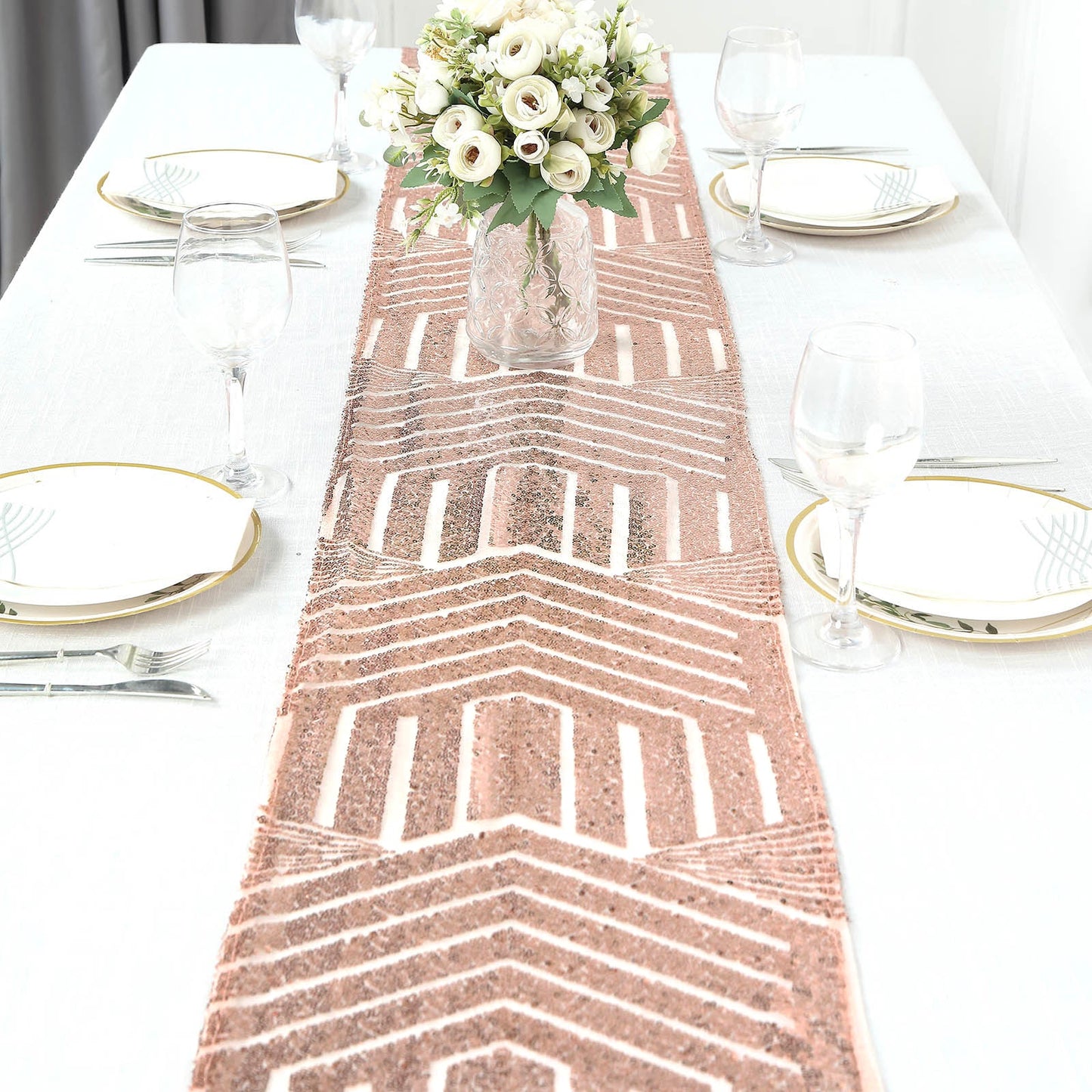 Rose gold sequin table runner with diamond glitz design on a dining table.
