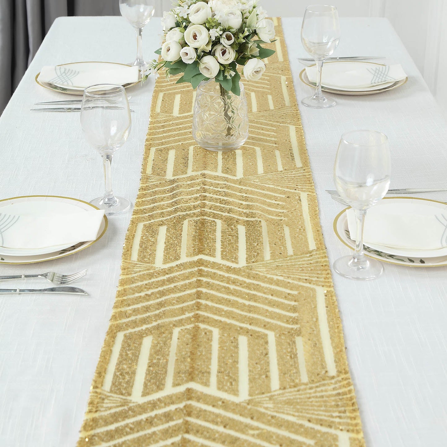 Gold diamond glitz sequin table runner on a white table setting.