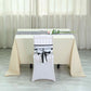 Black and white stripe satin table runner on a table setting.