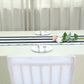 Black and white stripe satin table runner on a dining table.