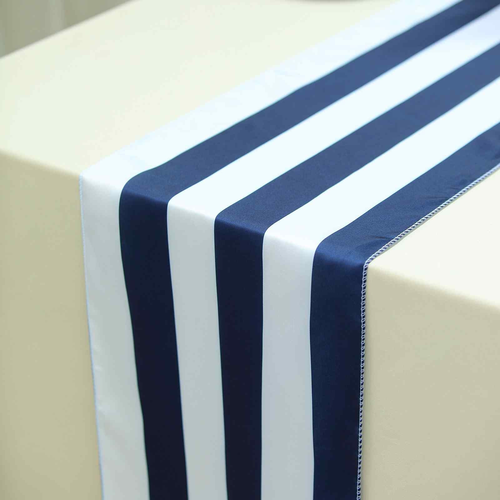 Navy and white striped satin table runner on a beige table.