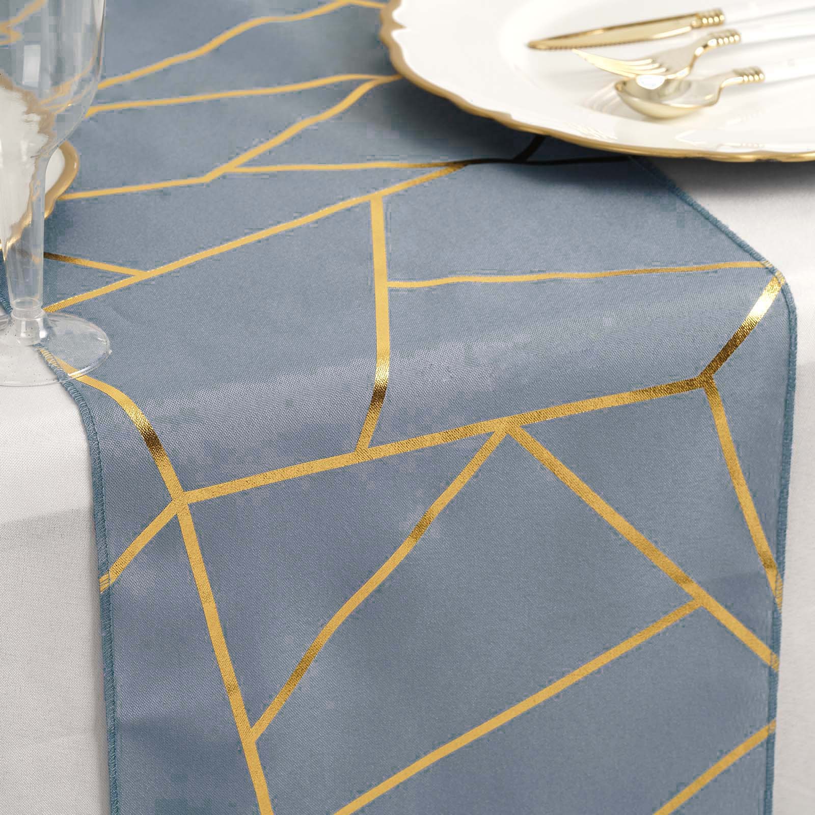 Dusty blue table runner with gold foil geometric pattern.