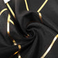Black table runner with gold foil geometric pattern, 9ft long.