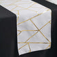 9ft white and gold geometric pattern table runner on a black table.