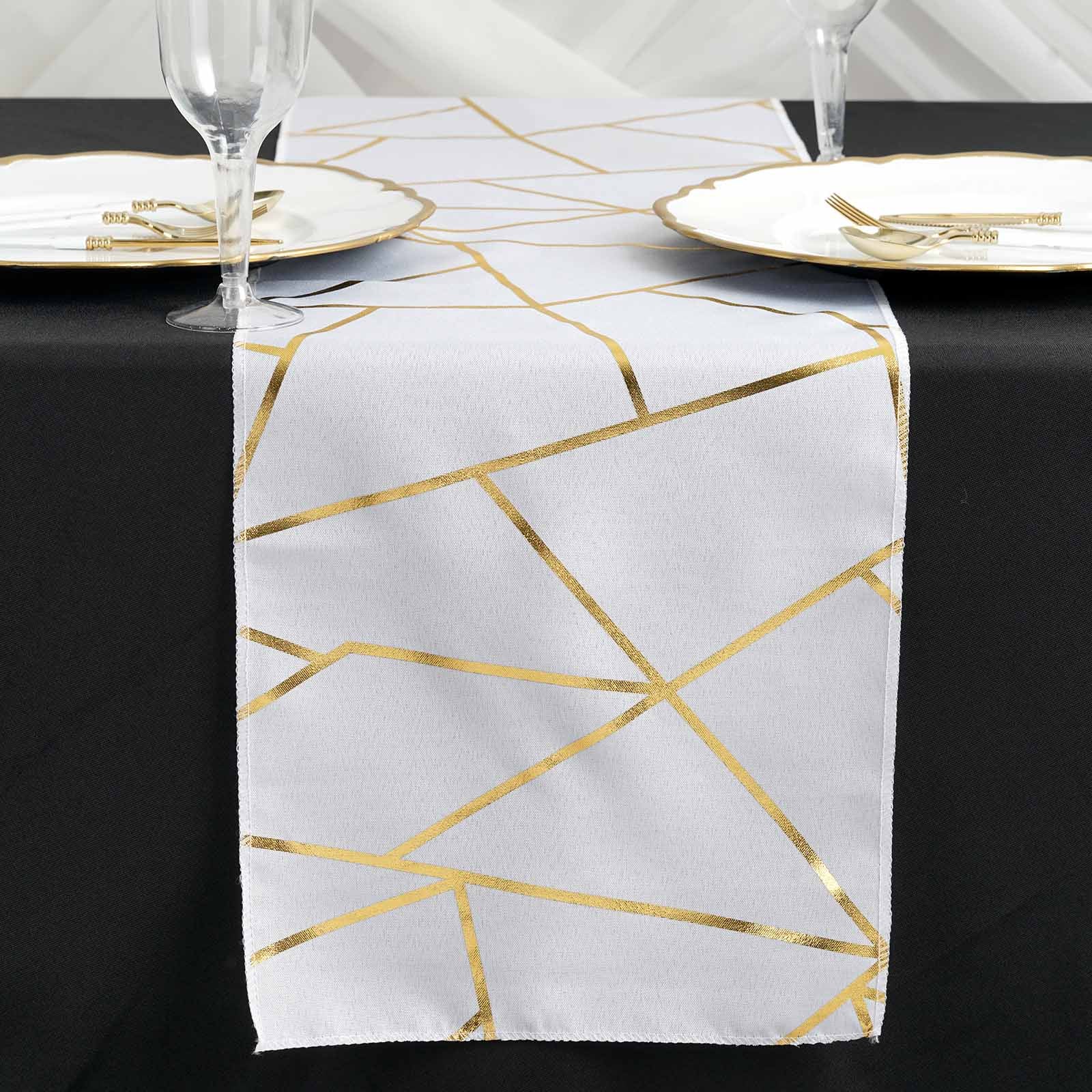 9ft white and gold foil geometric pattern table runner on a black table.