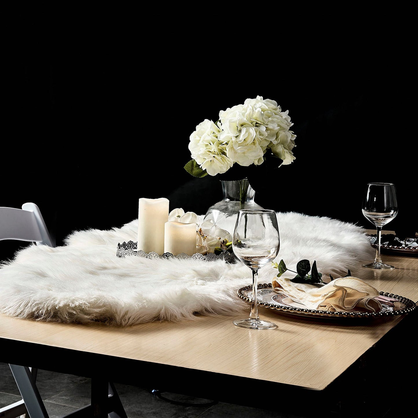 White fluffy area rug runner on a dining table with elegant decor.
