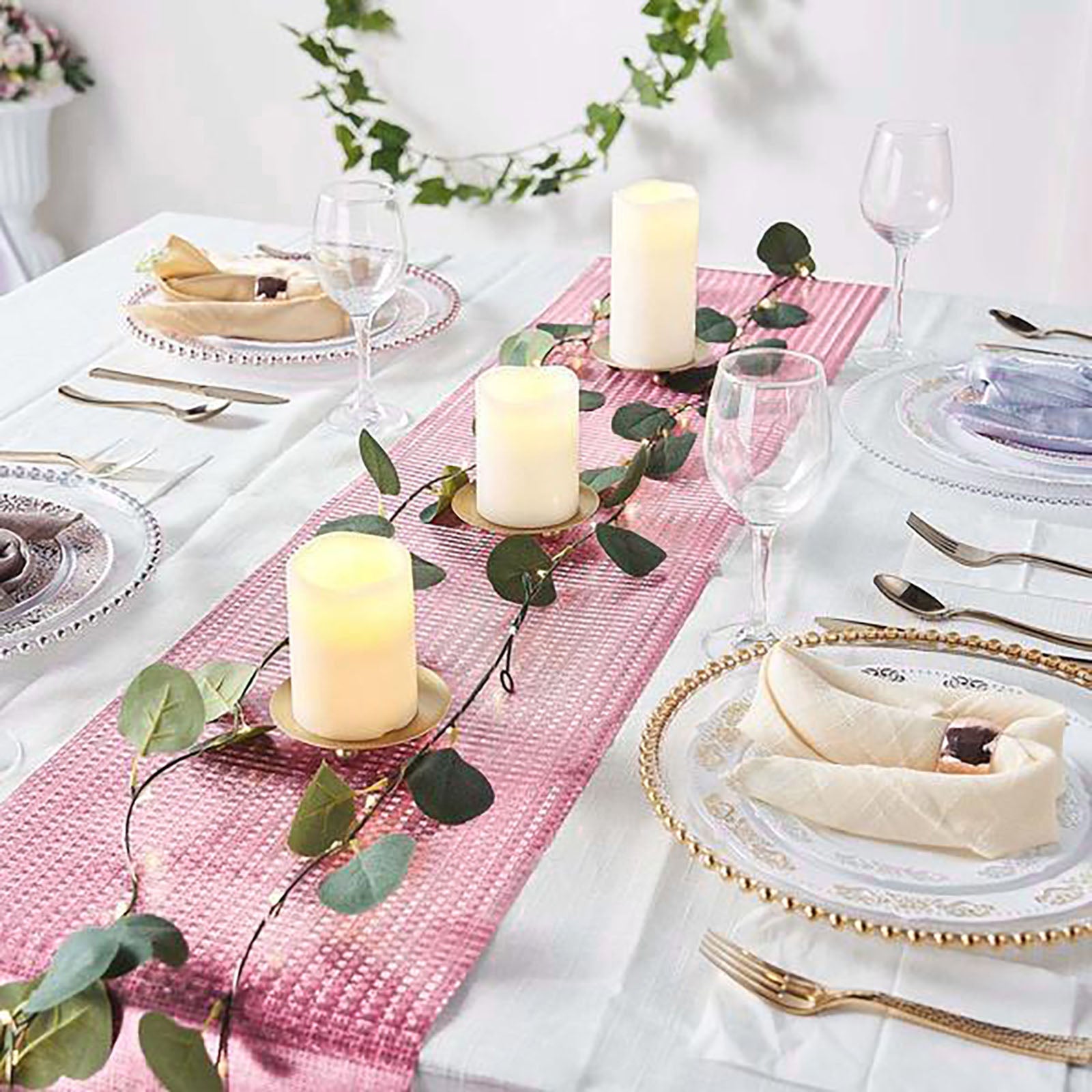 Rose gold sequin table runner on a beautifully set dining table.