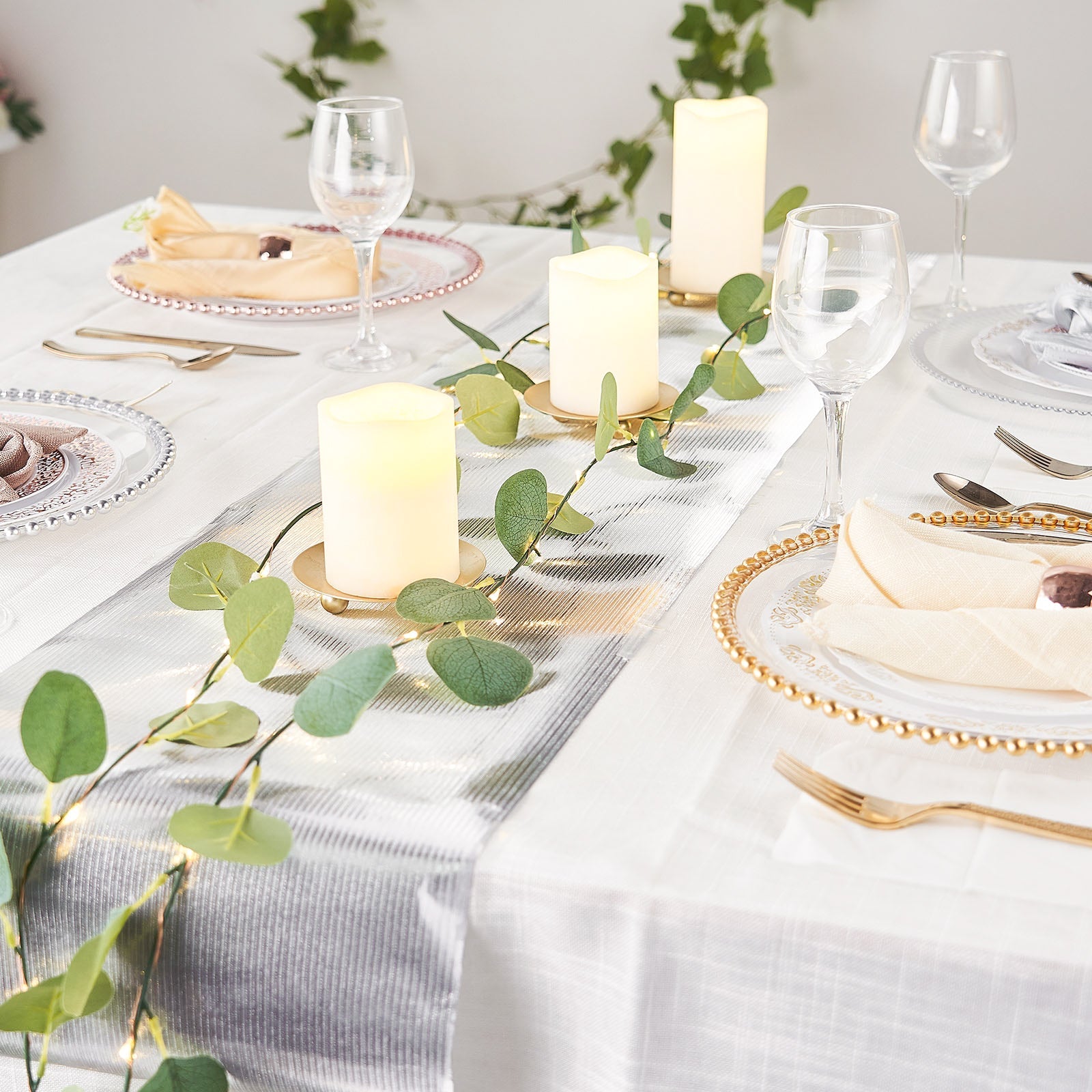 Silver glamorous column print table runner on a decorated dining table.
