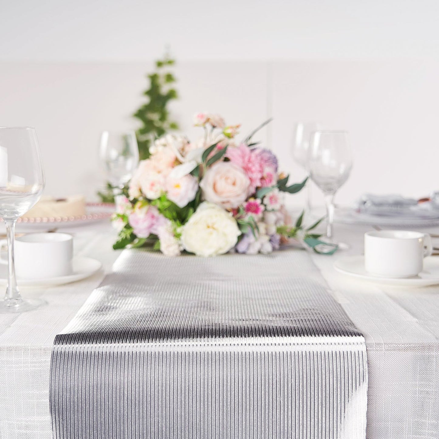Silver table runner with glamorous column print, perfect for elegant table settings.