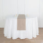 Taupe linen table runner on a round white table setting.