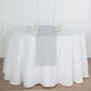 Silver linen table runner on a round table setting.