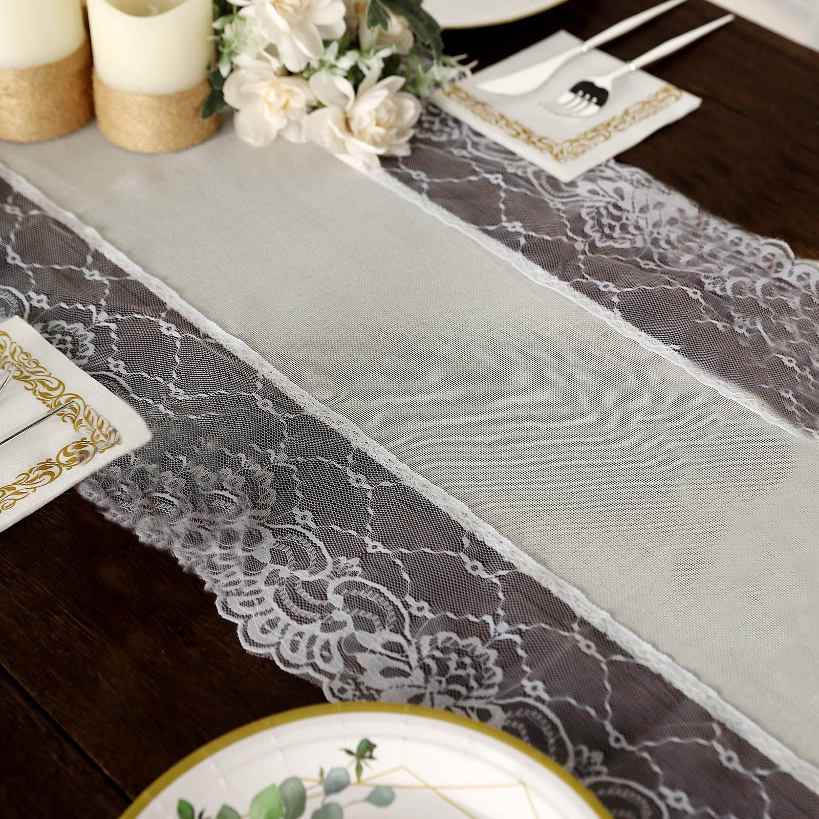 Ivory table runner with white lace edging on a rustic dining table.