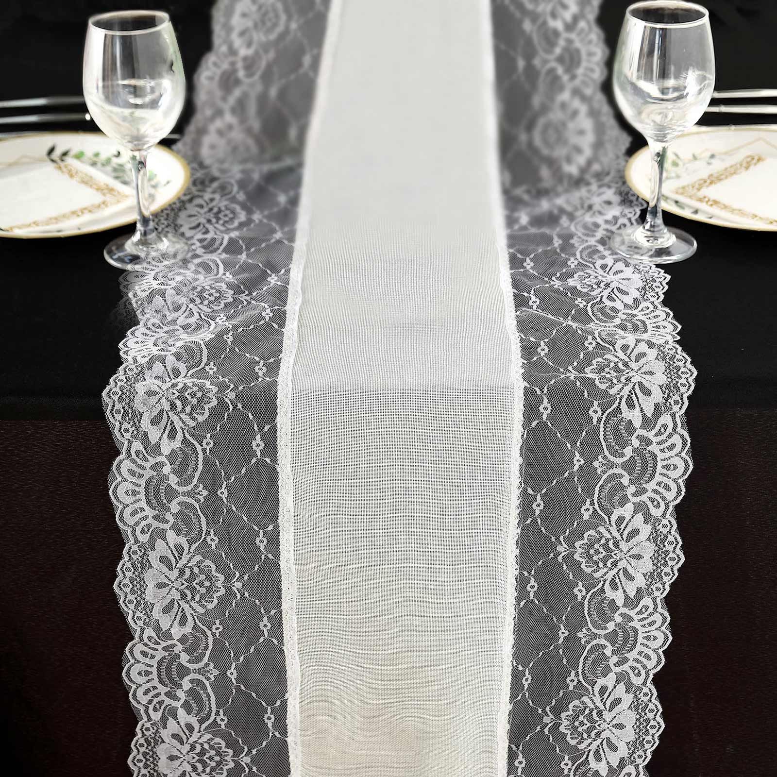 Ivory faux burlap jute table runner with white lace edging on a black table.
