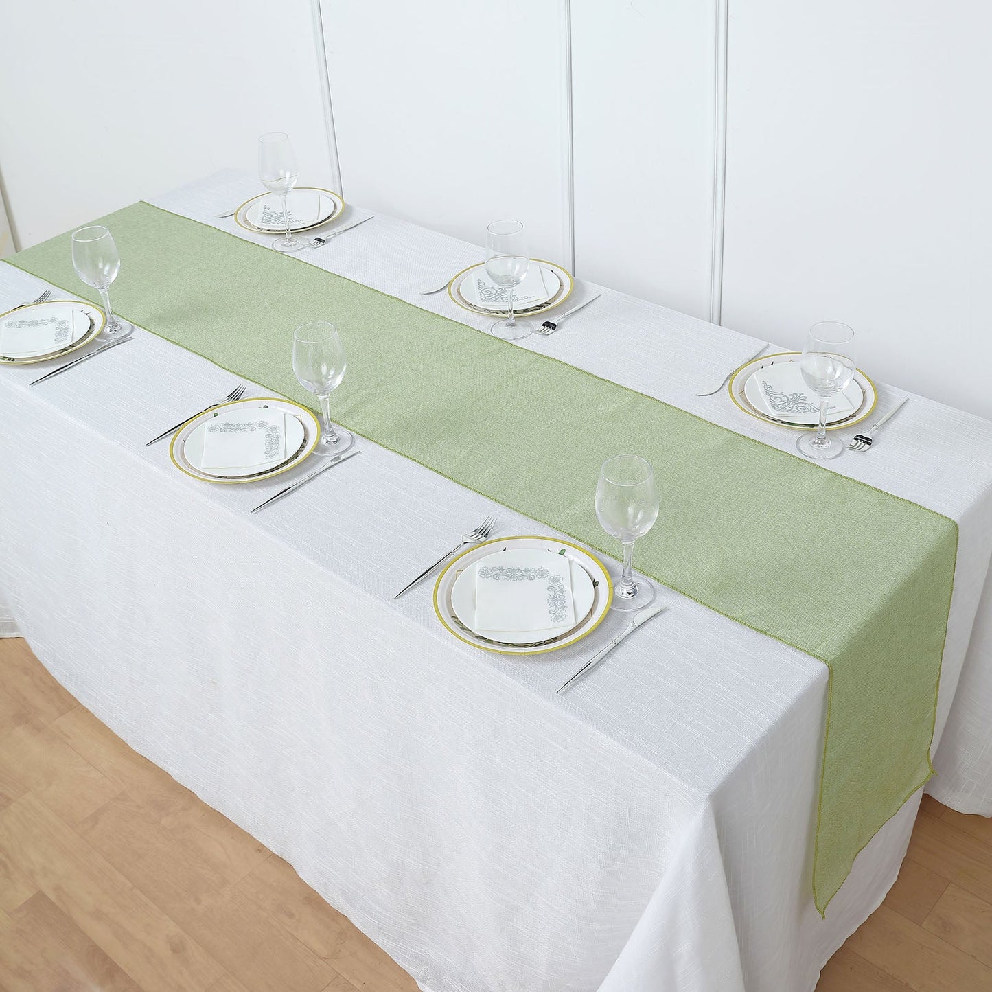 Sage green boho chic rustic faux jute linen table runner on a dining table.