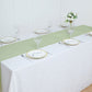 Sage green boho chic rustic faux jute linen table runner on a dining table.