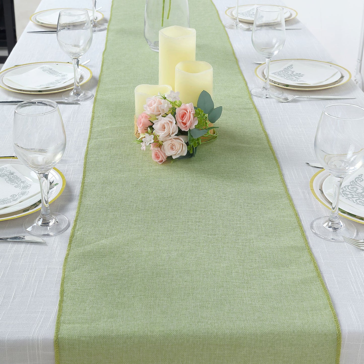 Sage green boho chic rustic faux jute linen table runner on a dining table.