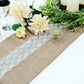 Natural jute burlap table runner with white lace, perfect for boho chic decor.