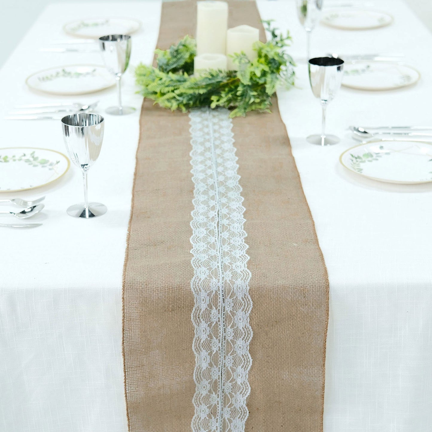 Natural jute burlap table runner with white lace, perfect for rustic decor.