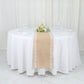 Natural jute burlap table runner with white lace trim on a round table.