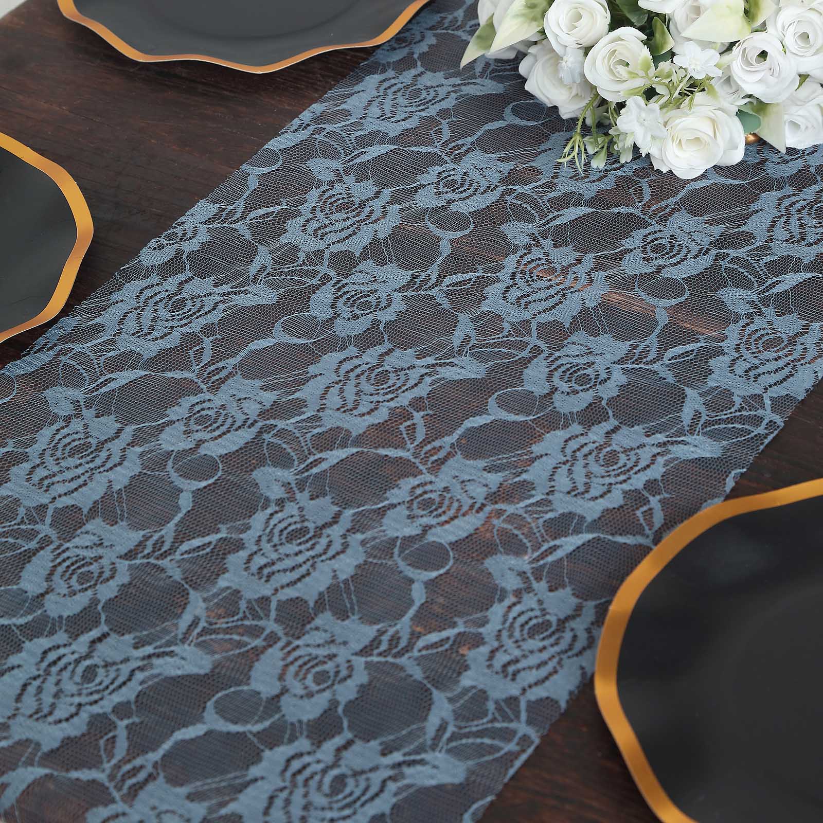 Dusty blue vintage rose lace table runner on a dark wooden table.