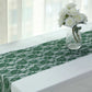 Hunter emerald green vintage lace table runner on a white table.