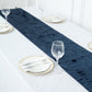 Navy blue 3D leaf petal taffeta fabric table runner on a white table.