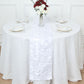 White 3D leaf petal taffeta fabric table runner on a round table.