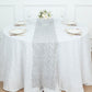 Silver sequin mesh lace table runner on a round table with floral centerpiece.
