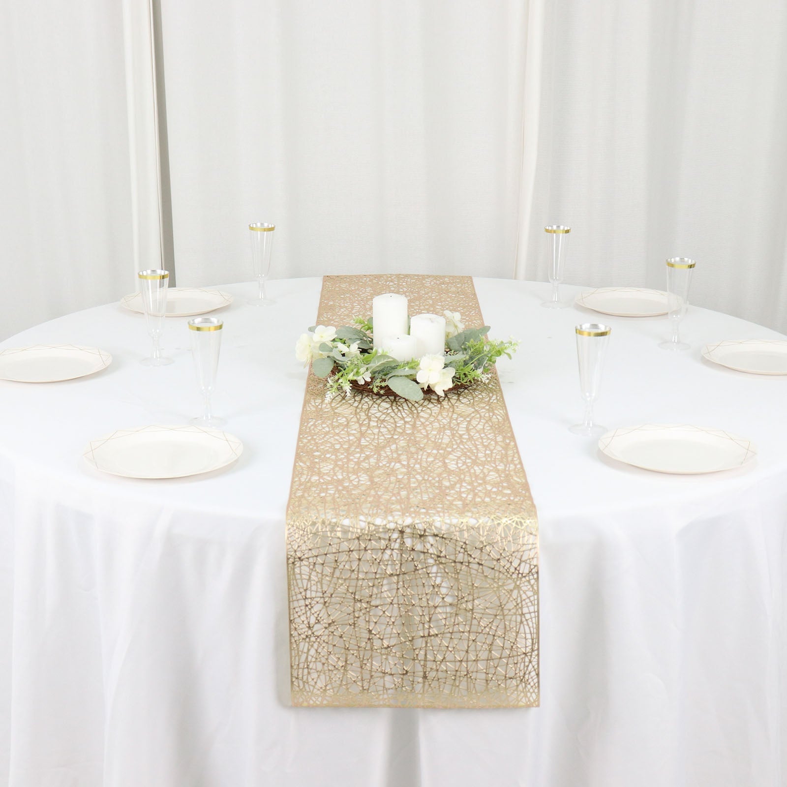 Metallic gold non-slip woven vinyl table runner on a white table.