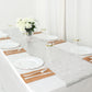 Metallic silver non-slip vinyl table runner on a dining table with white plates.