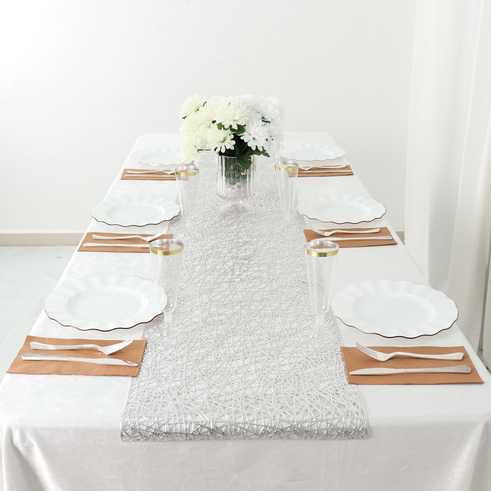 Metallic silver non-slip vinyl table runner on a dining table setting.